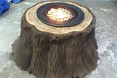 natural brown outdoor gas tree stump fire pit in Madison Wisconsin